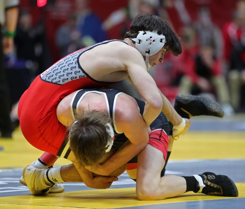 John Wrobel of Crestwood, top, works over Trent Rooke of Fredericktown during their 126 pound Division III match in the preliminary round of the 2024 OHSAA State Wrestling Tournament at the Schottenstein Center, Friday, March 8, 2024, in Columbus, Ohio.