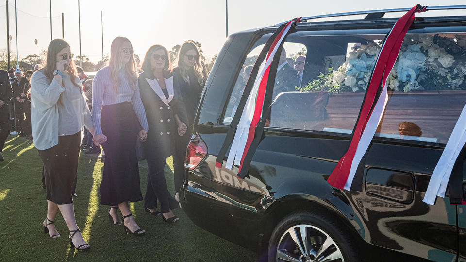 The Hearse carrying the coffin of Danny Frawley does a lap of honour and followed by his wife and daughters during the Danny Frawley Funeral Service on September 18, 2019 in Melbourne, Australia. (Photo by Asanka Ratnayake/Getty Images)