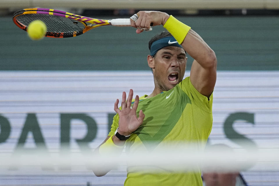 Spain's Rafael Nadal plays a shot against France's Corentin Moutet during their second round match at the French Open tennis tournament in Roland Garros stadium in Paris, France, Wednesday, May 25, 2022. (AP Photo/Christophe Ena)