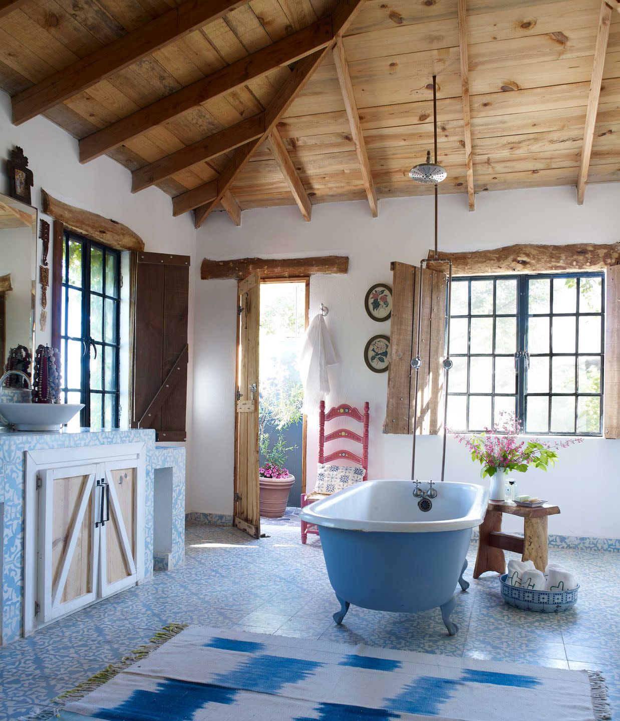 a bathroom with a tub and sink