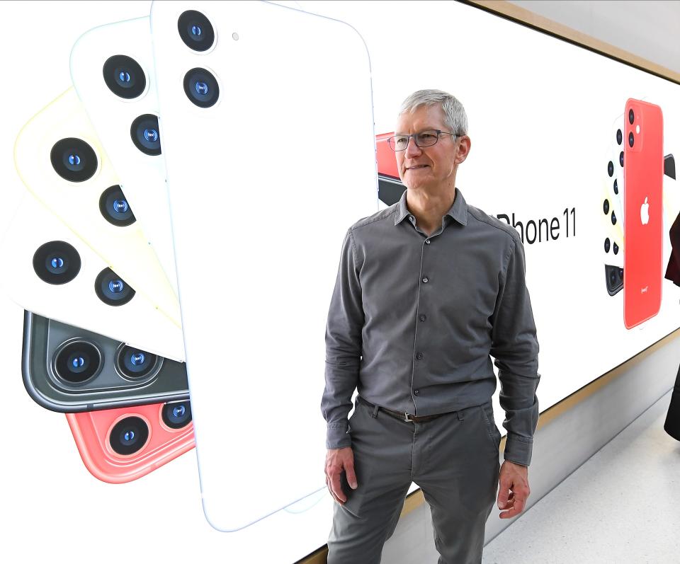CEO Tim Cook greets shoppers inside the Apple store on New York’s Fifth Avenue in September 2019.