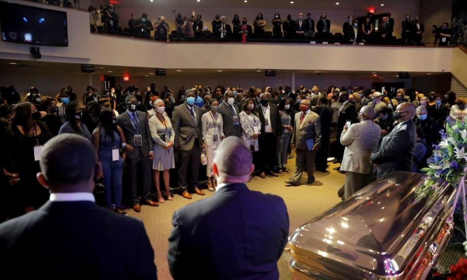 People attend a memorial service for George Floyd following his death in Minneapolis police custody.