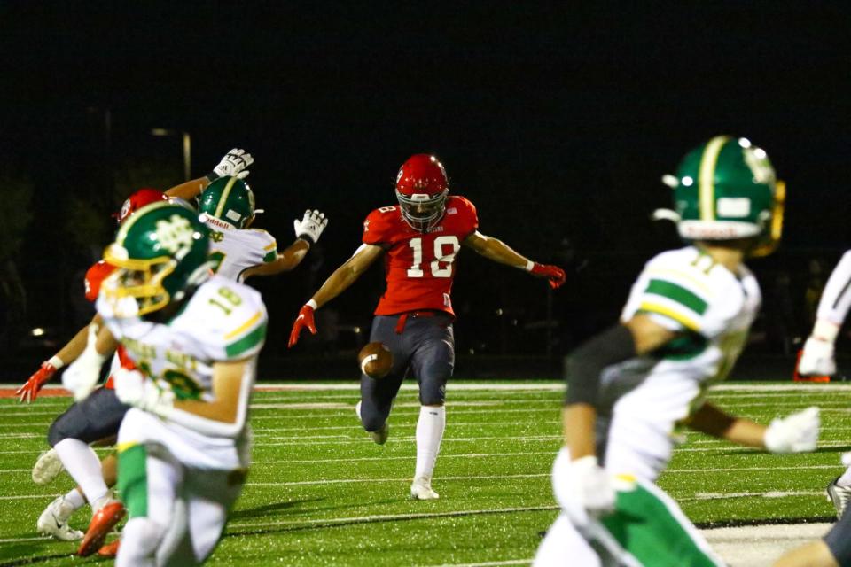 Johnstown senior Bryce Spangler punts during last week's game against Newark Catholic. Spangler also is a kicker and starting receiver for the Johnnies.