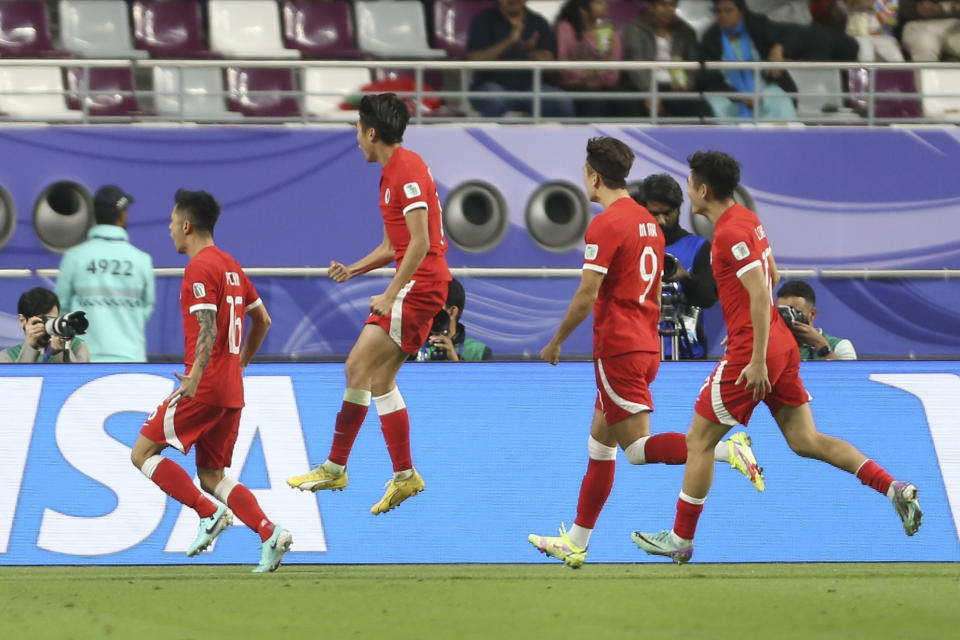 Hong Kong players celebrates after their team scores a goal during the Asian Cup Group C soccer match between Hong Kong and United Arab Emirates at Khalifa International Stadium in Doha, Qatar, Sunday, Jan. 14, 2024. (AP Photo/Hussein Sayed)