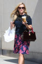 <p>Reese may have worn berries on her skirt, but it was a cup of coffee and lunch that she left Panera Bread with. (Photo: AKM-GSI) </p>