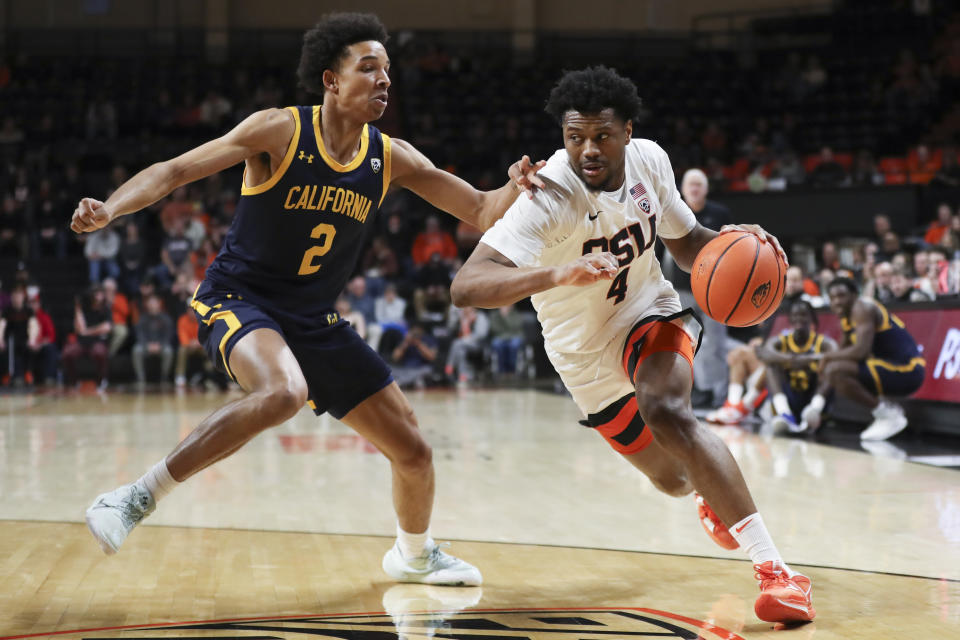 Oregon State guard Dexter Akanno (4) drives to the basket as California forward Monty Bowser (2) defends during the first half of an NCAA college basketball game in Corvallis, Ore., Saturday, March 4, 2023. (AP Photo/Amanda Loman)