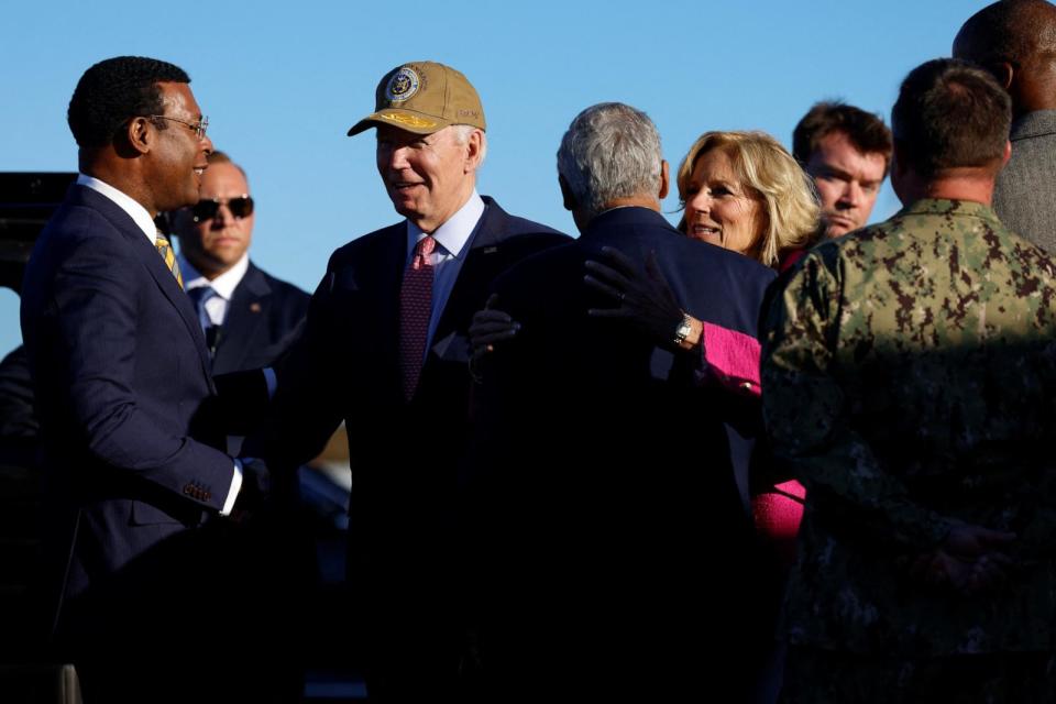 PHOTO: President Joe Biden and first lady Jill Biden greet service members and others after disembarking from Air Force One at Norfolk Naval Station in Norfolk, Va., Nov. 19, 2023.  (Julia Nikhinson/Reuters)