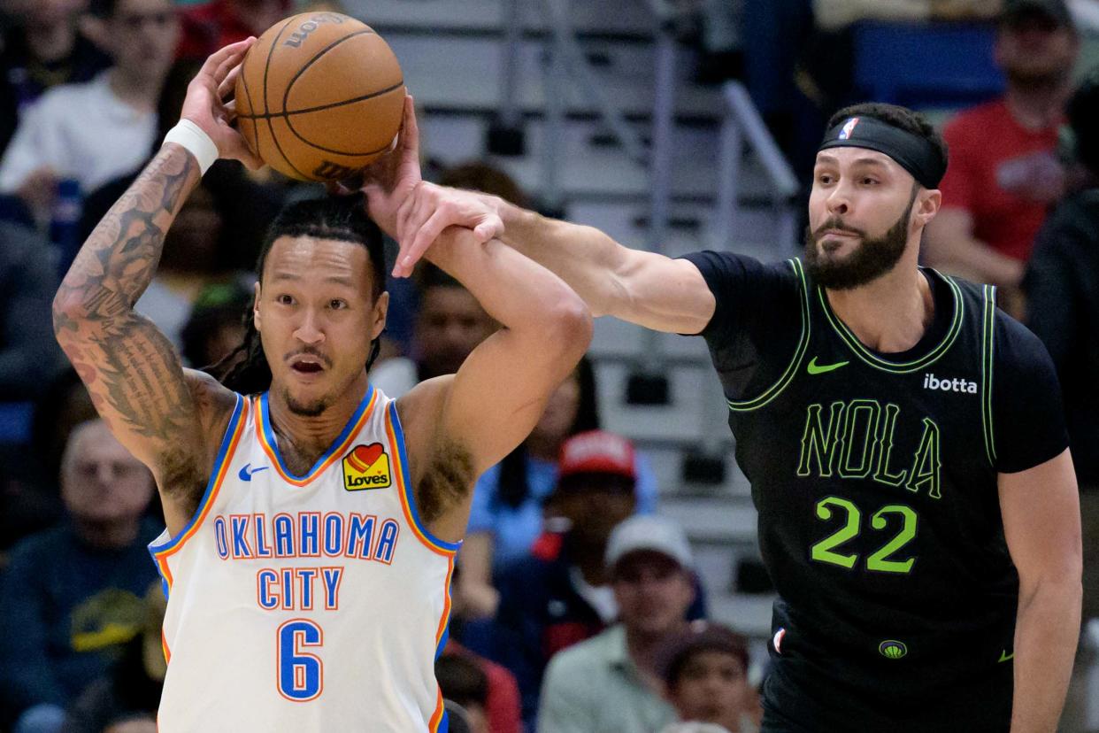 Mar 26, 2024; New Orleans, Louisiana, USA; Oklahoma City Thunder forward Jaylin Williams (6) tries to pass as New Orleans Pelicans forward Larry Nance Jr. (22) makes contact during the first half at Smoothie King Center. Mandatory Credit: Matthew Hinton-USA TODAY Sports