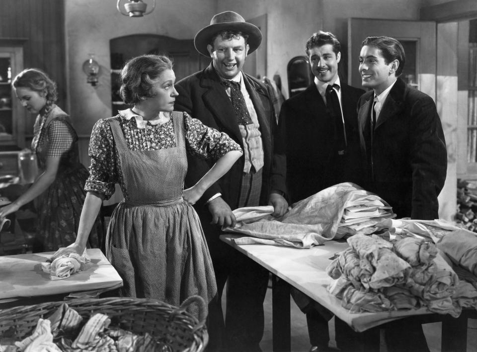 Alice Brady as Molly O'Leary, Andy Devine as Pickle Bixby, Don Ameche as Jack O'Leary, and Tyrone Power as Dion O'Leary in the 1937 film In Old Chicago