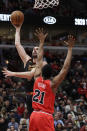 Cleveland Cavaliers forward Kevin Love, left, shoots next to Chicago Bulls forward Thaddeus Young during the second half of an NBA basketball game in Chicago, Saturday, Jan. 18, 2020. (AP Photo/Nam Y. Huh)