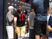 San Francisco 49ers quarterback Jimmy Garoppolo walks past reporters after chatting following a combined NFL football training camp with the Denver Broncos at the Broncos' headquarters Friday, Aug. 16, 2019, in Englewood, Colo. (AP Photo/David Zalubowski)