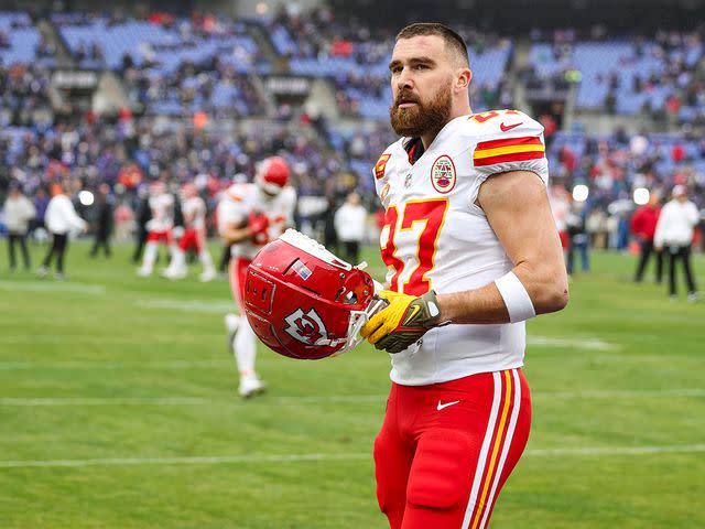 <p>Perry Knotts/Getty </p> Travis Kelce warming up before his AFC Championship game in January