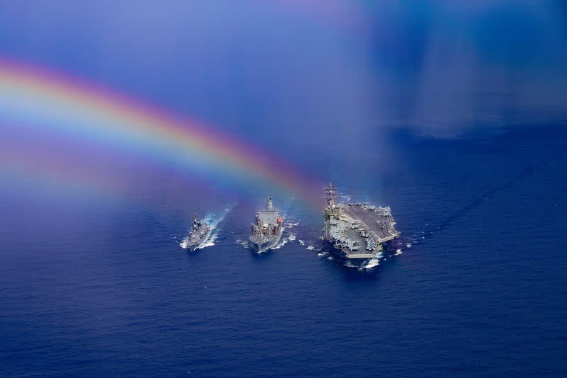 Japanese Maritime Self-Defense Force Murasame-class destroyer Ikazuchi, fleet replenishment oiler USNS John Ericsson (T-AO 194) and U.S. Navy aircraft carrier USS Ronald Reagan (CVN 76) steam ahead in the Philippine Sea