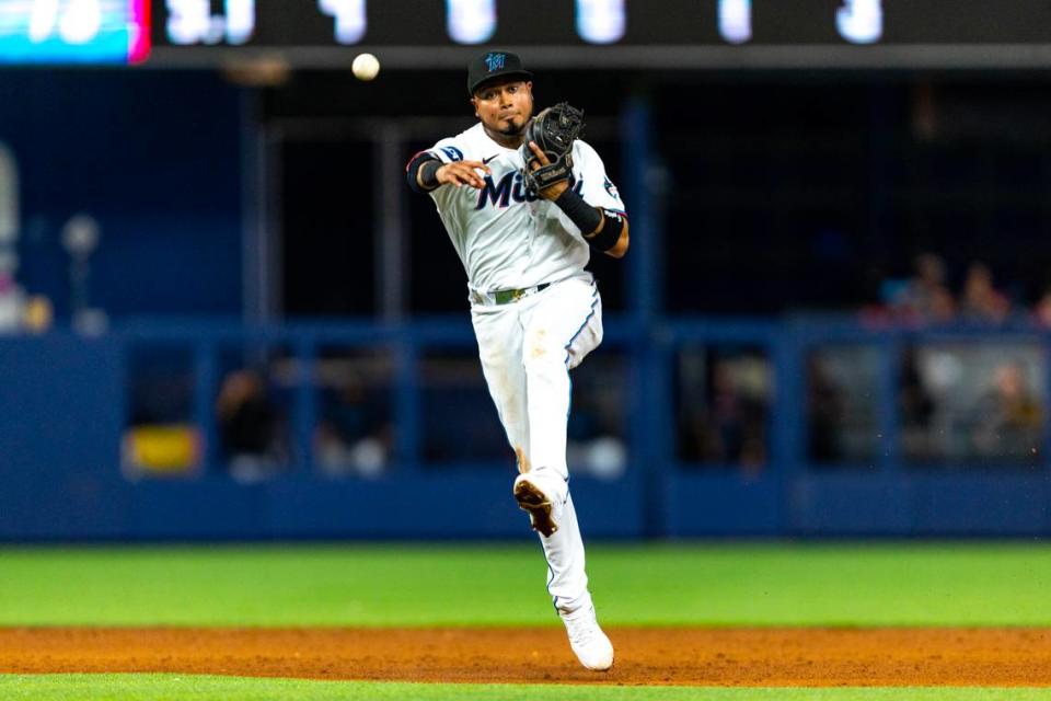 Miami Marlins second baseman Luis Arraez (3) throws the ball to first base for an out during the sixth inning of an MLB game against the Philadelphia Phillies at loanDepot park in the Little Havana neighborhood of Miami, Florida, on Tuesday, August 1, 2023.