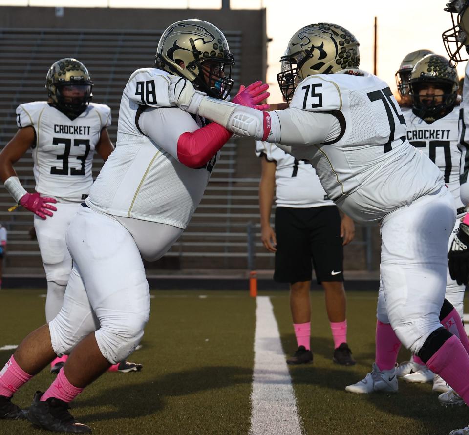 Crockett defensive lineman Amado Peña-Gonzalez, jostling with teammate Austin Anguiano last season, will play football next year at Southwestern University. He is a big reason the Cougars are 6-3 heading into this week's game against LBJ.