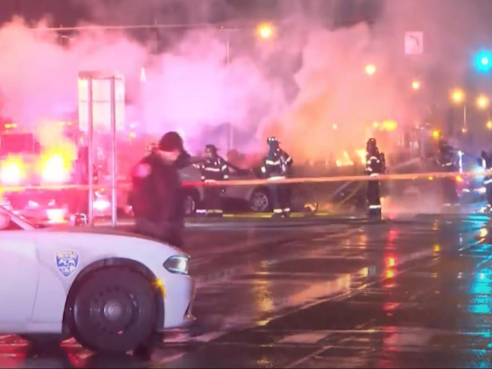 Police and firefighters in Rochester, New York, battle a blaze at the scene of a fiery New Year’s Eve car crash that killed two (screengrab/YouTube/CBS8)