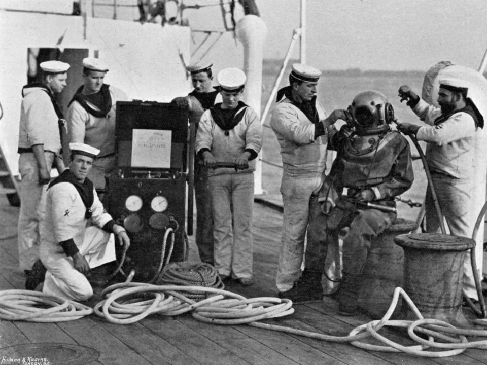 A diver and his equipment aboard the HMS Blake in 1895.