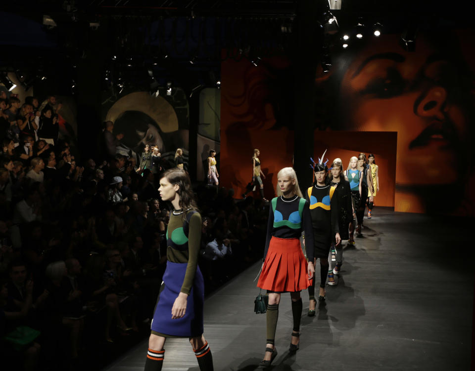 Models wear creations for Prada's women's Spring-Summer 2014 collection, part of the Milan Fashion Week, unveiled in Milan, Italy, Thursday, Sept. 19, 2013. (AP Photo/Luca Bruno)