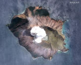 In this satellite image taken and released on Dec. 11, 2019, by Maxar Technologies steam rises from the volcano on White Island off the coast of Whakatane, New Zealand. A New Zealand island volcano vented more steam and mud Wednesday in an increase of geothermal activity that again delayed the recovery of victims' bodies from a deadly eruption two days ago. (Satellite image ©2019 Maxar Technologies via AP)