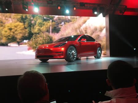 A Tesla Model 3 sedan, its first car aimed at the mass market, is displayed during its launch in Hawthorne, California, March 31, 2016. REUTERS/Joe White/File Photo