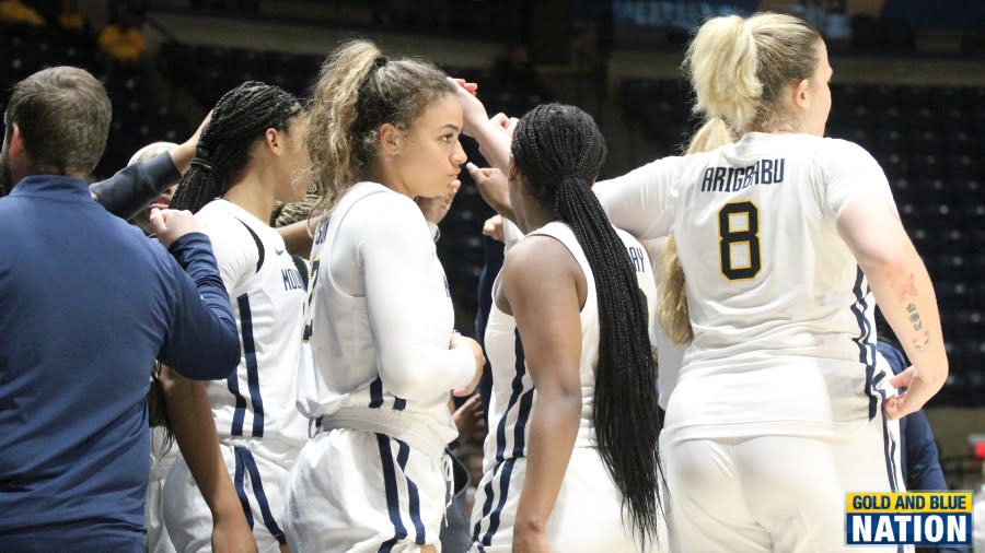 The 2023-2024 WVU women’s basketball team huddles in the first half of its season opener vs. Loyola (Md). (Photo Ryan Decker, Gold and Blue Nation)