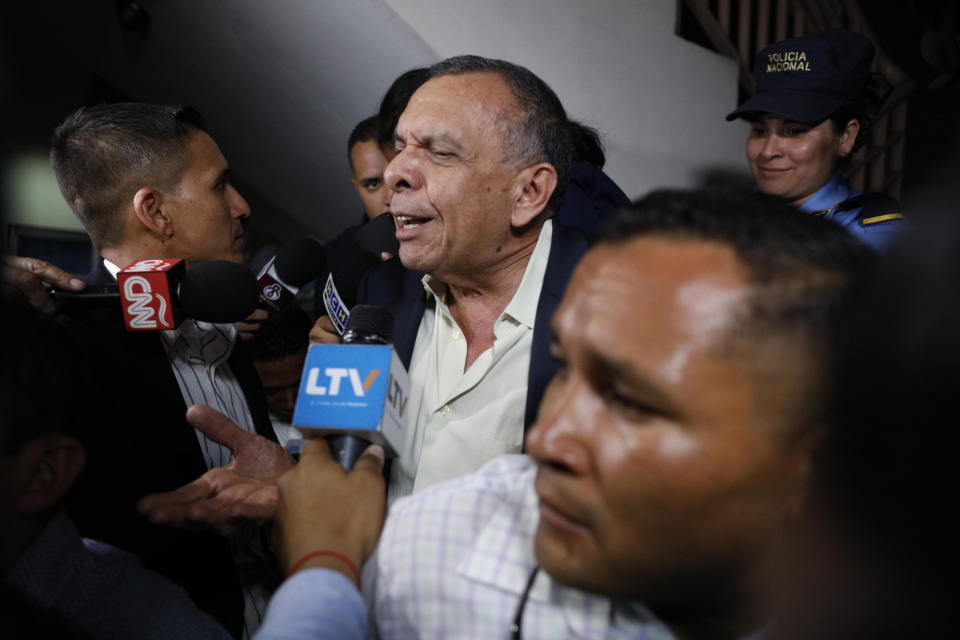 FILE - In this Aug. 20, 2019 file photo, former Honduran President Porfirio Lobo speaks to the press outside court where his wife, former first lady Rosa Elena Bonilla de Lobo, was convicted on corruption charges in Tegucigalpa, Honduras. A former drug boss Devis Leonel Rivera Maradiaga testified in court on Friday, Oct. 11, that he had paid a bit more than half a million dollars to Lobo in exchange for protection from being extradited to the United States. (AP Photo/Elmer Martinez, File)