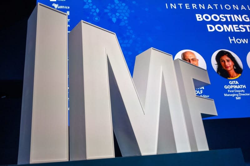 International Monetary Fund (IMF) logo stands at a meeting of the annual meeting of the International Monetary Fund and the World Bank. The IMF on 30 January improved its forecast for global economic growth in the coming year, raising its expectations to 3.1% from an earlier forecast of 2.9% in October. Christophe Gateau/dpa