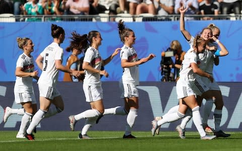 Alexandra Popp of Germany celebrates with teammates after scoring her team's first goal  - Credit: Getty Images