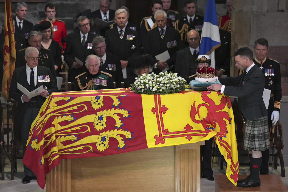 From left, Prince Andrew, King Charles III, Camilla, the Queen Consort, Princess Anne and Vice Admiral Sir Tim Laurence, look on as the Duke of Hamilton places the Crown of Scotland on the coffin during the Service of Prayer and Reflection for the Life of Queen Elizabeth II at St Giles' Cathedral, Edinburgh, Monday Sept. 12, 2022. (Aaron Chown/Pool Photo via AP)