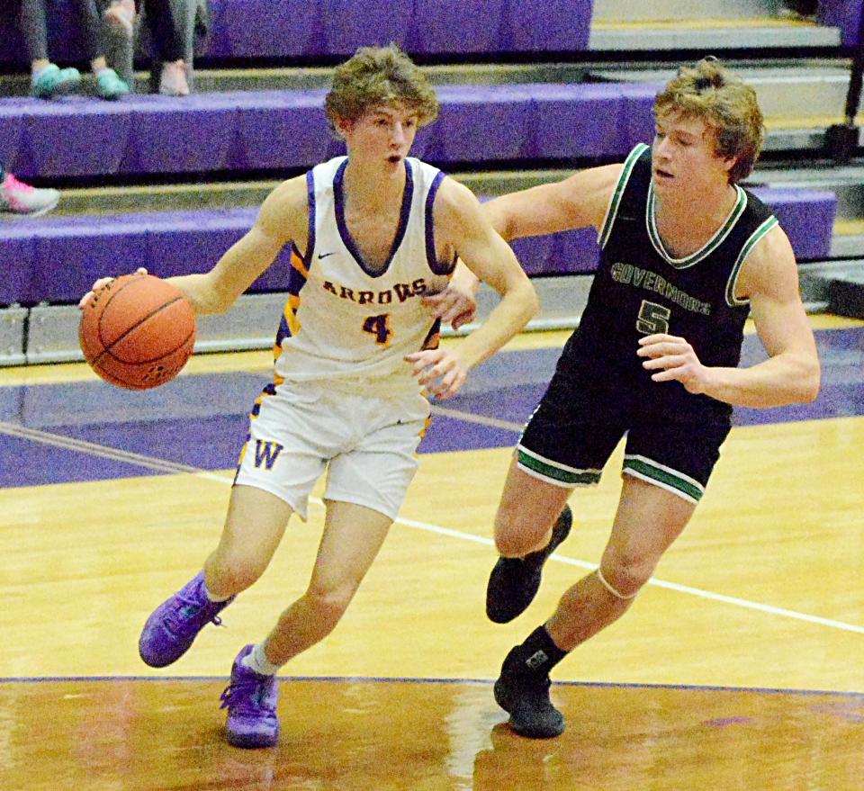 Watertown's Dylon Rawdon (4) drives the baseline against Pierre's Cade Kaiser during an Eastern South Dakota Conference boys basketball game on Tuesday, Dec. 20, 2022 in the Watertown Civic Arena. Pierre won 64-46.