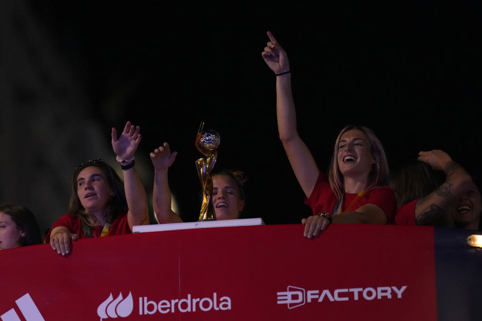 Spain's Women's World Cup soccer team celebrate on top of bus as they arrive in Madrid, Spain, Monday, Aug. 21, 2023. Spain beat England in Sydney Sunday to win the Women's World Cup soccer final. (AP Photo/Manu Fernandez)