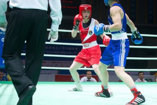 Katie Taylor (L) of Ireland clashes with Sofya Ochigava of Russia during bout at the Women's World Boxing Championships in China in May 2012. Taylor, the 25-year-old having won her fourth successive world title in China