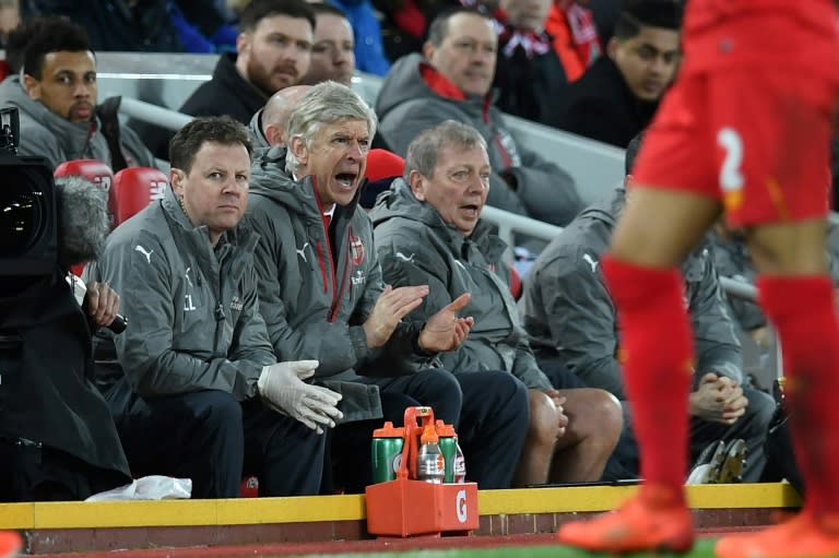 Arsenal's manager Arsene Wenger (C) gestures from the dug-out during their match at Liverpool on March 4, 2017