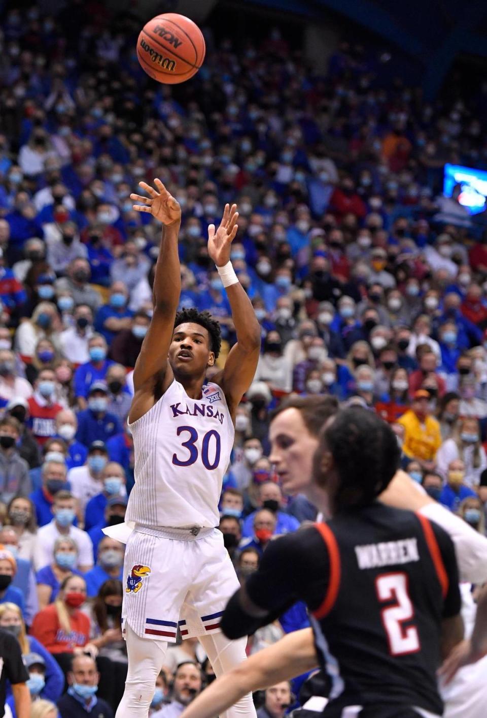 KU’s Ochai Agbaji puts up a three pointer during the second half of Monday night’s game at Allen Fieldhouse. KU beat Tech, 94-91 in double overtime.