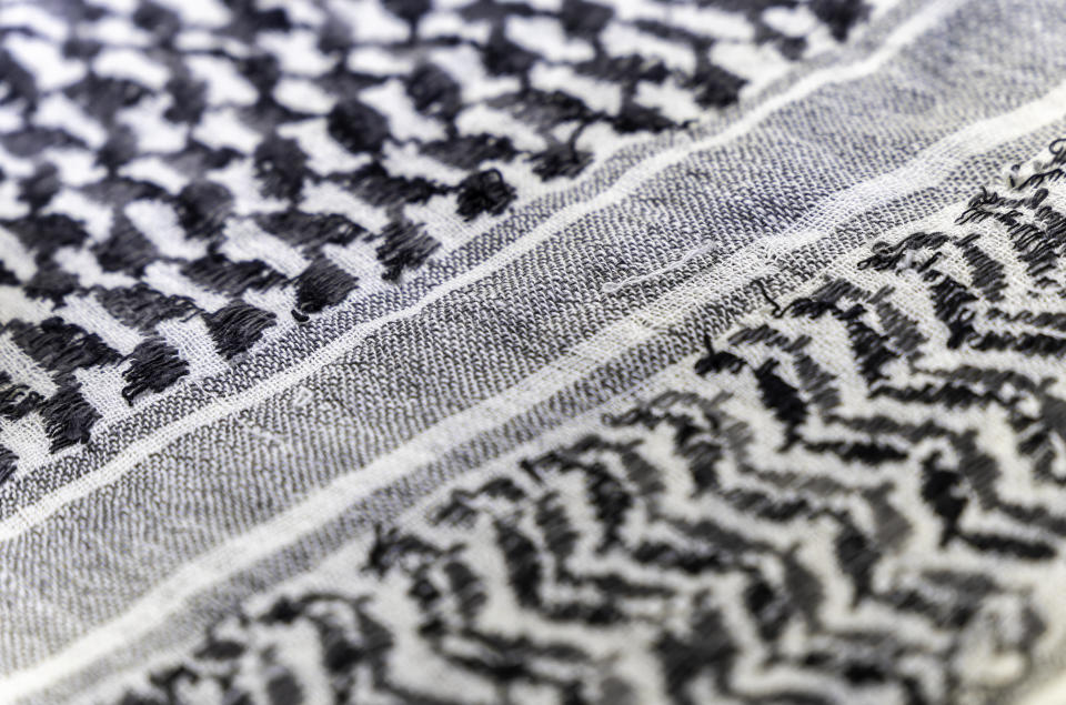 close-up of a Palestinian headscarf or kufiya. The traditional black and white headscarf of the Arab man (Keffiyeh). The weave forms a diagonal path