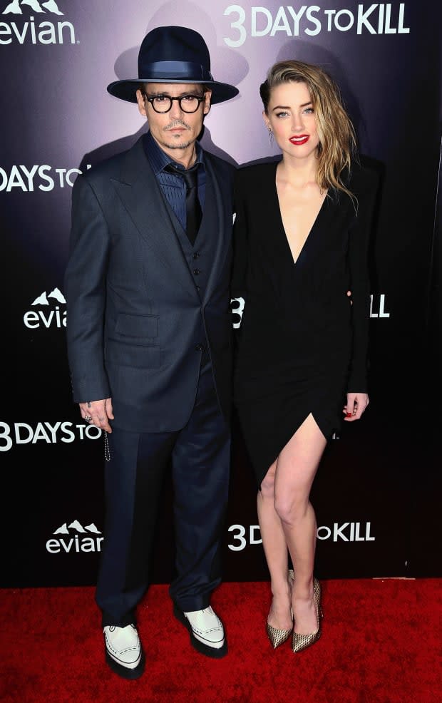 Johnny Depp and Amber Heard attend the premiere of Relativity Media's "3 Days to Kill" at ArcLight Cinemas on Feb. 12, 2014, in Hollywood.<p><a href="https://www.gettyimages.com/detail/469081667" rel="nofollow noopener" target="_blank" data-ylk="slk:David Livingston/Getty Images;elm:context_link;itc:0;sec:content-canvas" class="link ">David Livingston/Getty Images</a></p>