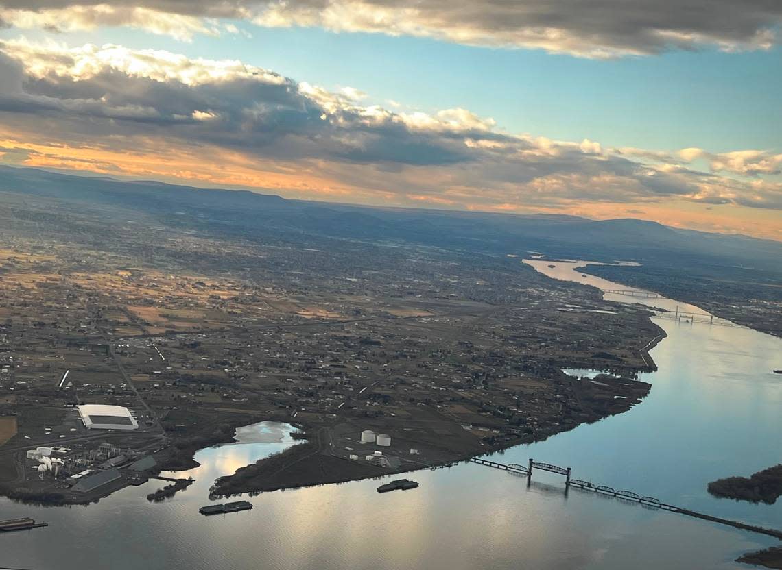 The Columbia River and bridges between Kennewick and Pasco are pictured in this aerial shot taken from an airplane beginning its descent for landing at the Tri-Cities Airport in February 2022.