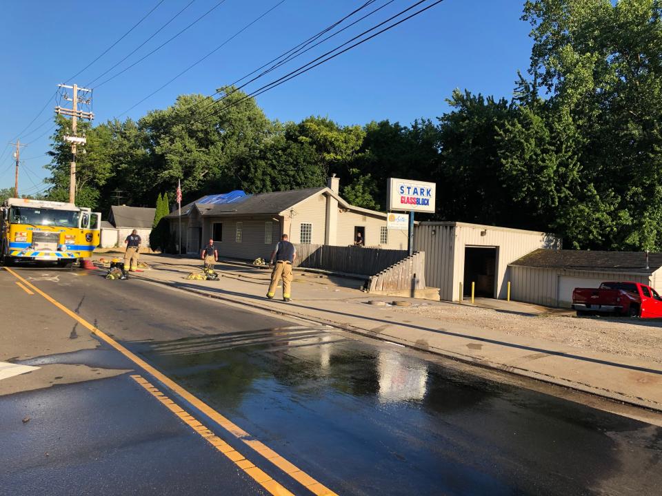 Canton Township firefighters wrap up their work Thursday evening after extinguishing a fire at Stark Glass Block on 12th Street NW.