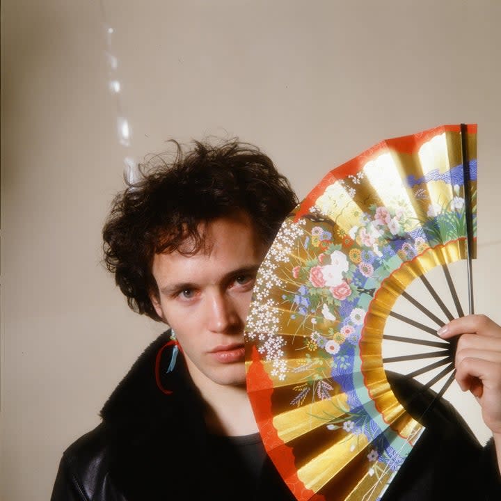 adam ant with a hand fan