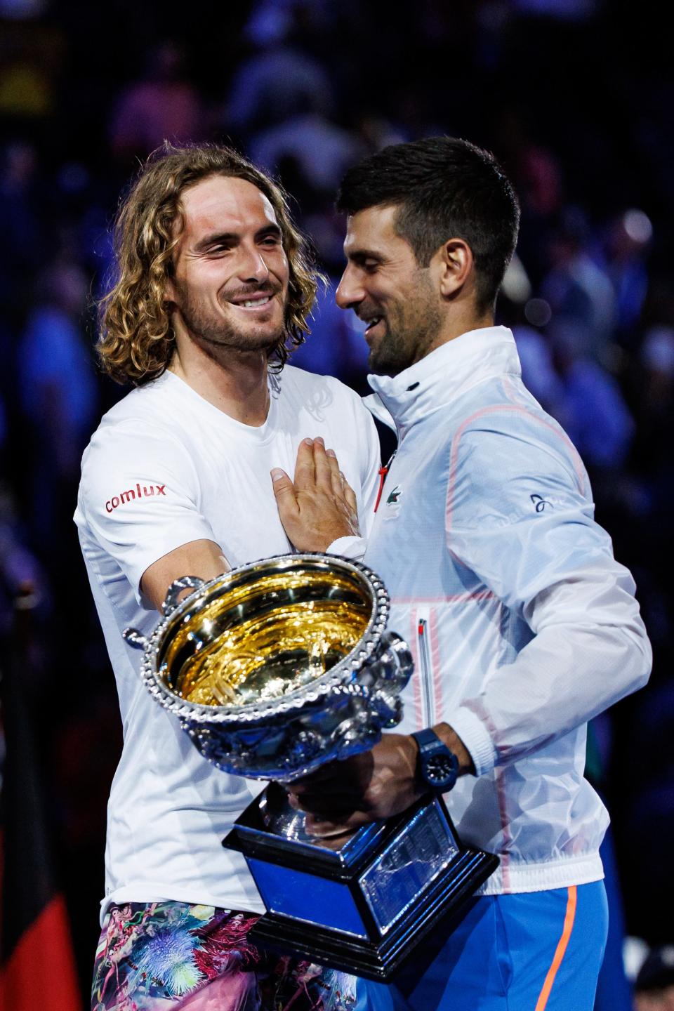 Stefanos Tsitsipas (left) embraces Novak Djokovic following their battle in the 2023 Australian Open final.