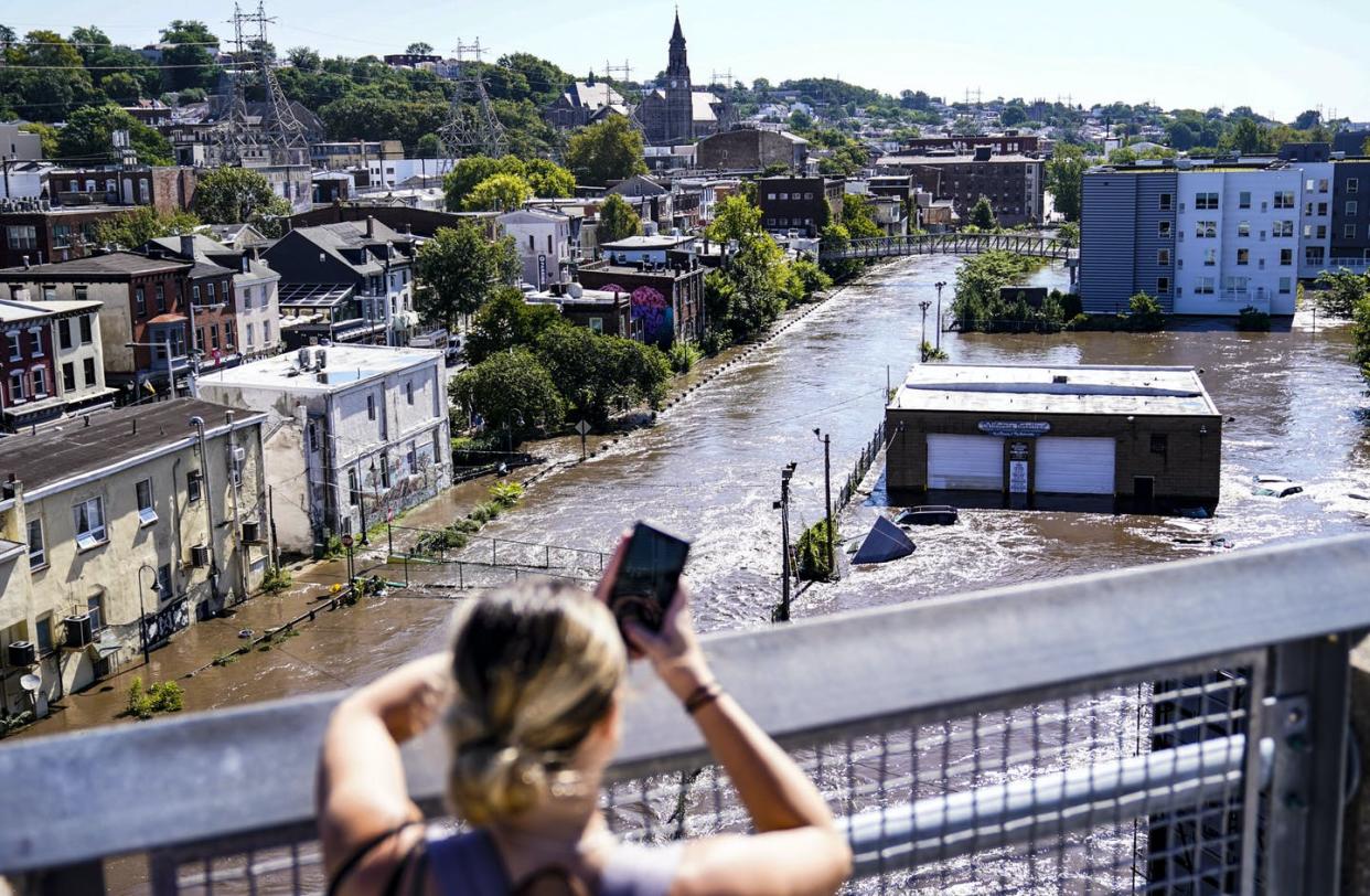 <span class="caption">Flooding is seen in the Manayunk section of Philadelphia after the remnants of Hurricane Ida, Sept. 2, 2021. </span> <span class="attribution"><a class="link " href="https://newsroom.ap.org/detail/ClimateChange-ImperiledSubways/471dc2d5dc744140804437803ca2216c/photo" rel="nofollow noopener" target="_blank" data-ylk="slk:AP Photo/Matt Rourke;elm:context_link;itc:0;sec:content-canvas">AP Photo/Matt Rourke</a></span>