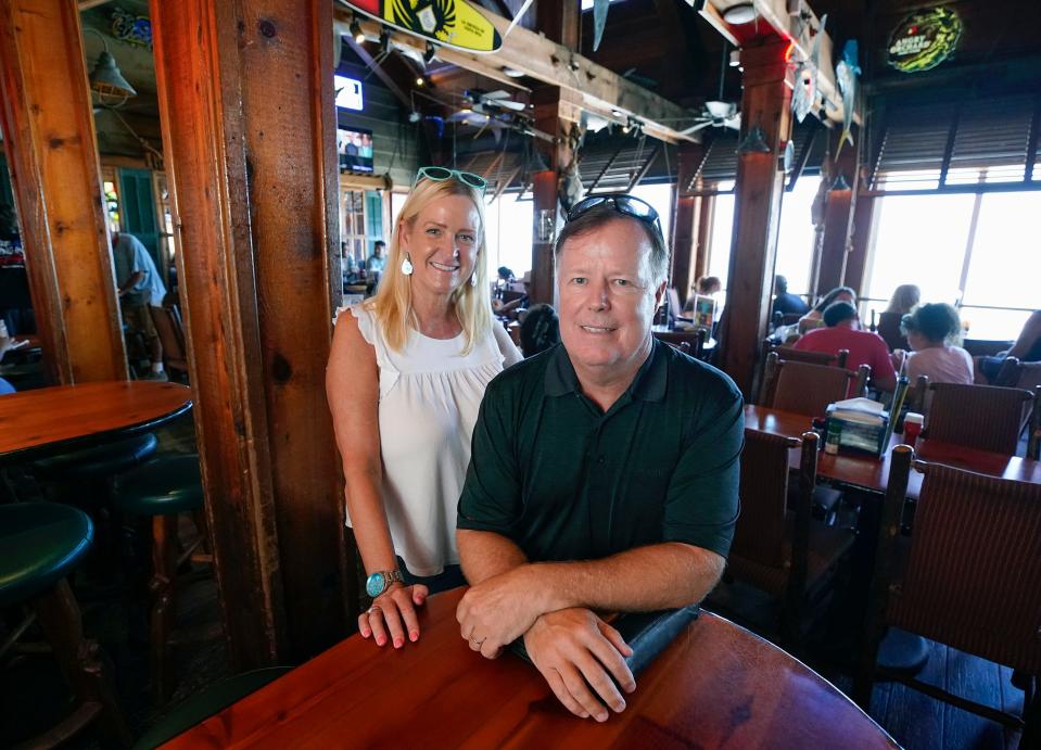 Matt and Connie Fuerst, owners of the Ocean Deck Restaurant & Beach Club along with business partners Ken Bots and Vernon Kuftic, are pictured in the restaurant's upstairs dining room. The Ocean Deck has been a beachside fixture since 1957.