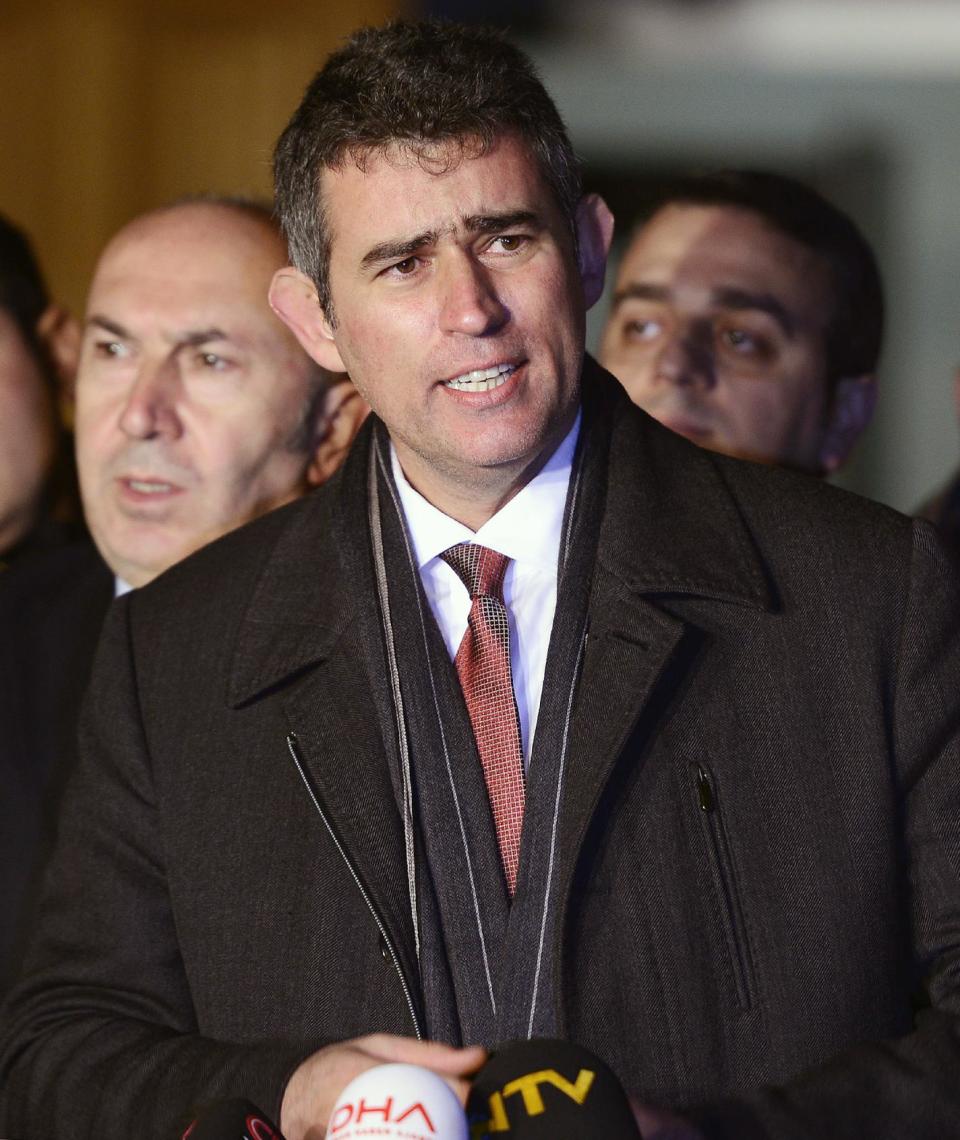 Metin Feyzioglu, the head of the Turkish Bar Associations, speaks to the media after a meeting with Prime Minister Recep Tayyip Erdogan in Istanbul, Turkey, Saturday, Jan. 4, 2014. Feyzioglu said that Erdogan has instructed Turkey's justice minister to work with the group on legal arrangements that could lead to the re-trial of hundreds of military officers and others. Hundreds of people have been jailed in Turkey for alleged plots to bring down Erdogan's government. The officers say much of the evidence against them was fabricated. (AP Photo)