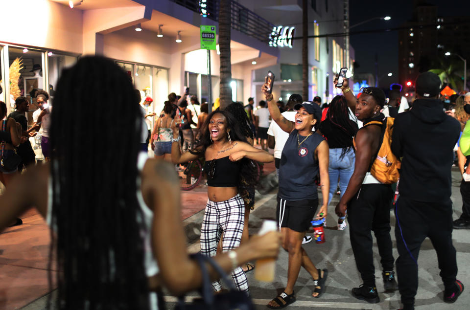 MIAMI BEACH, FLORIDA - MARCH 21: People leave the area as an 8pm curfew goes into effect on March 21, 2021 in Miami Beach, Florida. College students have arrived in the South Florida area for the annual spring break ritual, prompting city officials to impose an 8pm to 6am curfew as the coronavirus pandemic continues. Miami Beach police have reported hundreds of arrests and stepped up deployment to control the growing spring break crowds. (Photo by Joe Raedle/Getty Images)