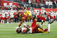 Southern California defensive back Max Williams (4) flies over Utah tight end Thomas Yassmin (87) after a pass reception by Yassmin during the first half of the Pac-12 Conference championship NCAA college football game Friday, Dec. 2, 2022, in Las Vegas. (AP Photo/Steve Marcus)