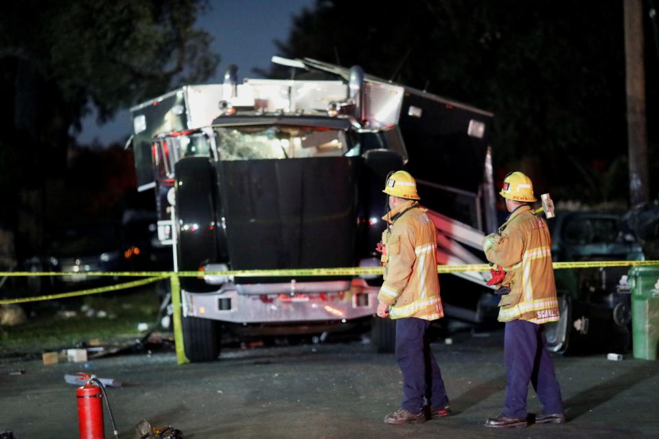 Image: A damaged vehicle is seen at the site of an explosion after police attempted to safely detonate illegal fireworks that were seized, in Los Angeles (DAVID SWANSON / Reuters)