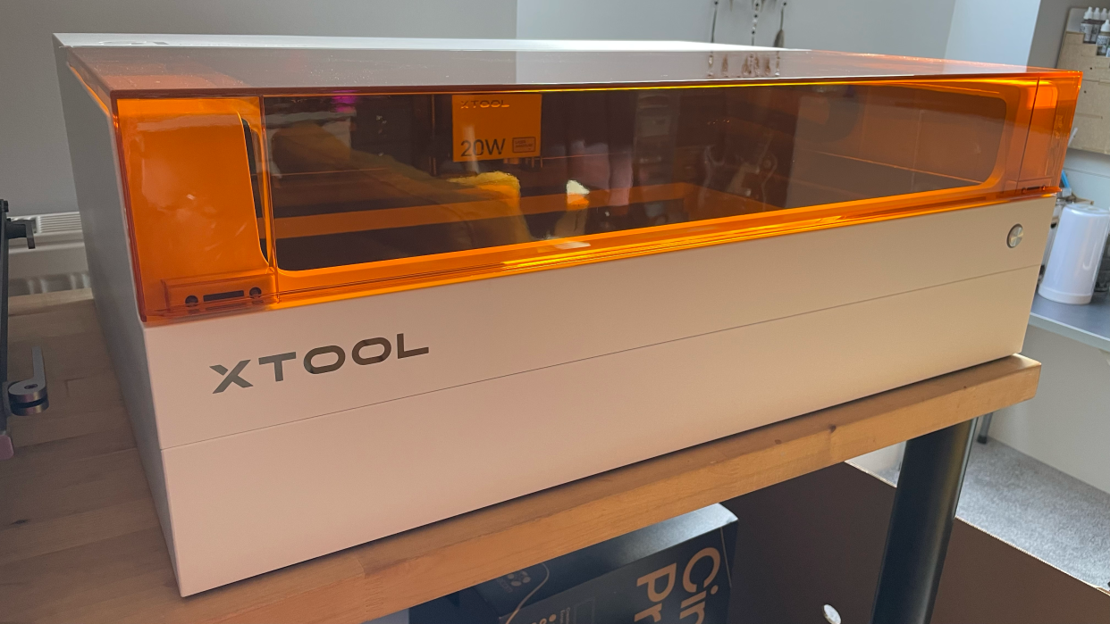  XTool S1 review; a white laser machine on a table. 