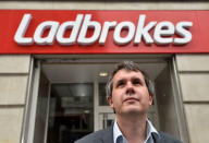 Matthew Shaddick, Head of Political Betting at Ladbrokes poses at a branch of Ladbrokes in central London, Britain, May 17, 2016. REUTERS/Toby Melville