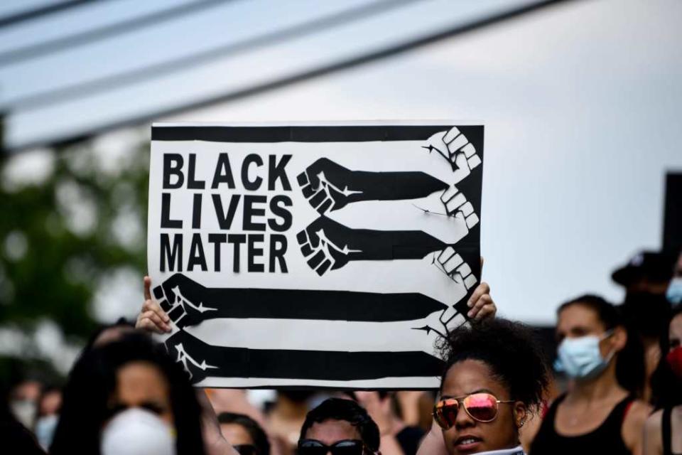 Protestor holds ‘Black Lives Matter’ sign at rally in Wayne on June 6. WayneRally.jpg