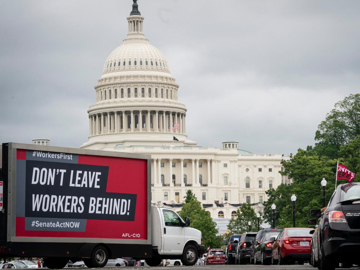 <p>Protesters take part in the AFL-CIO Workers First Caravan for Racial and Economic Justice near the U.S. Capitol on 17 June 2020 in Washington DC</p> ((Getty Images))